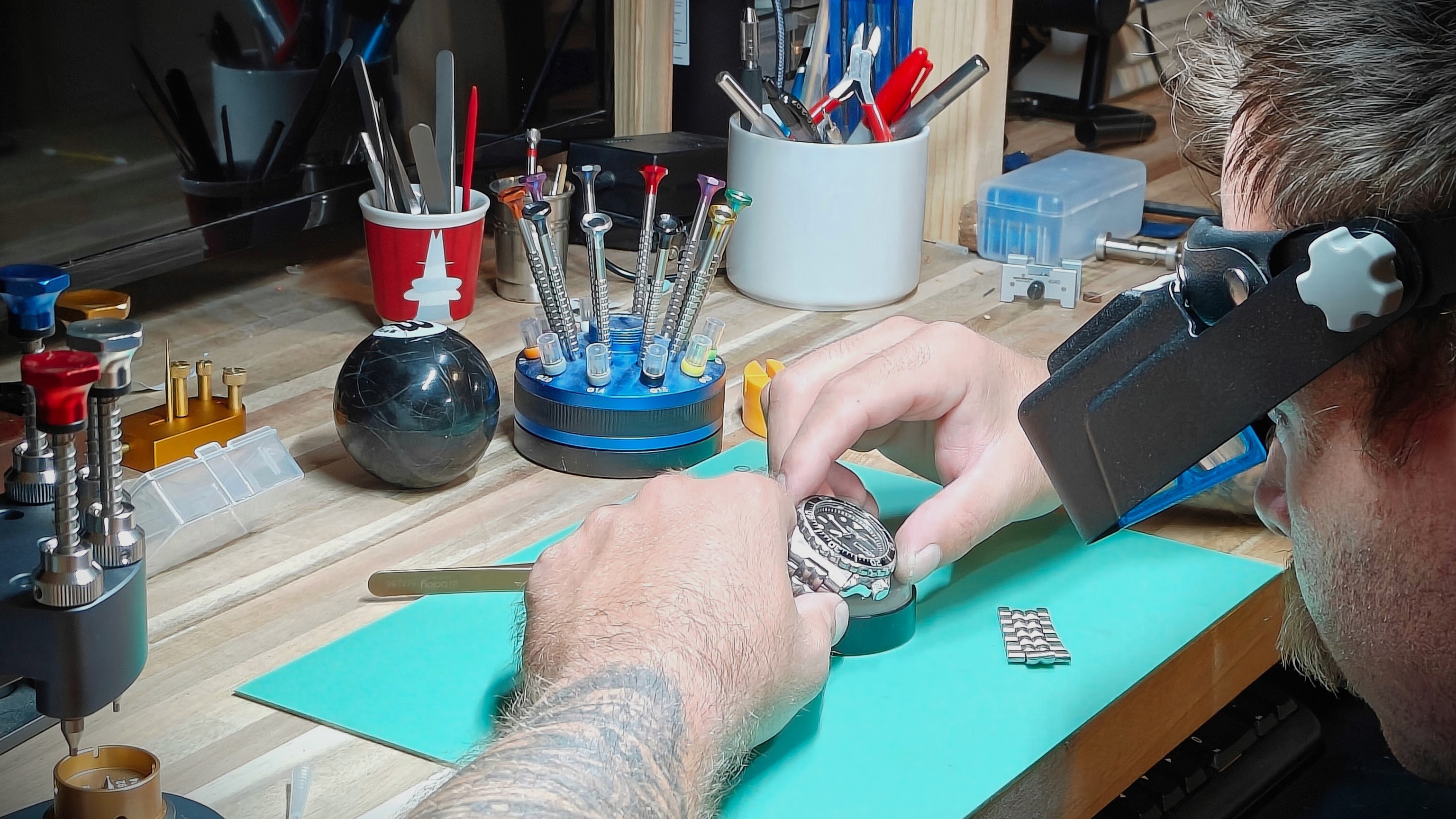 Liberi Watch Co maker working at the bench